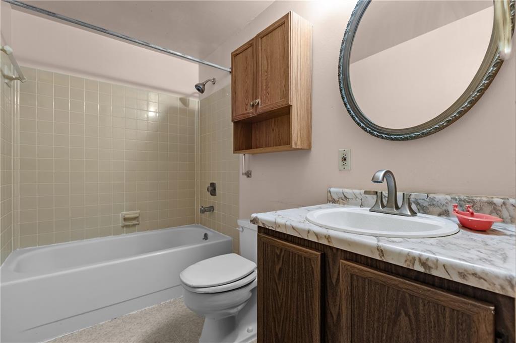 300 Moon Ridge Drive Freedom, PA 15042 - Photo 15 of 32 a bathroom with a sink and a mirror