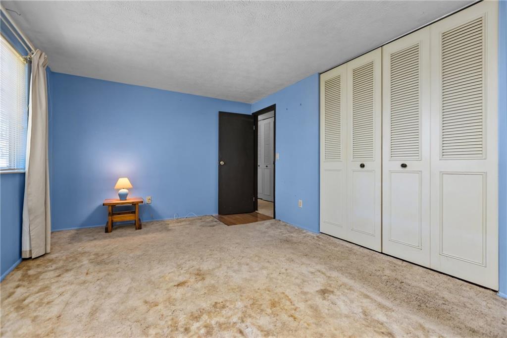 300 Moon Ridge Drive Freedom, PA 15042 - Photo 17 of 32 a bedroom with a bed and a car parked in it