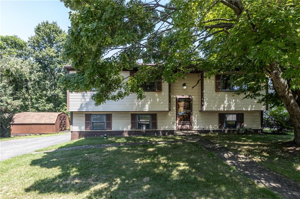 300 Moon Ridge Drive Freedom, PA 15042 - Photo 2 of 32 a front view of a house with a yard