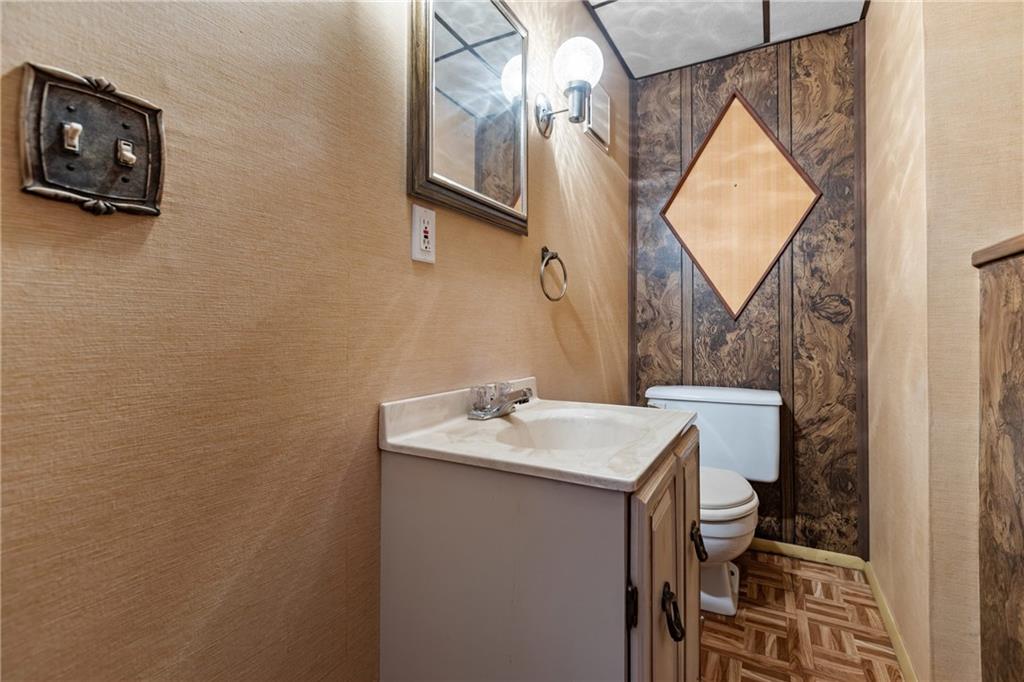 300 Moon Ridge Drive Freedom, PA 15042 - Photo 26 of 32 a bathroom with a sink and a mirror