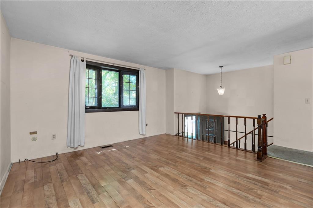 300 Moon Ridge Drive Freedom, PA 15042 - Photo 5 of 32 a view of an empty room with wooden floor