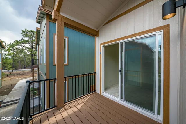 a view of a house with wooden deck