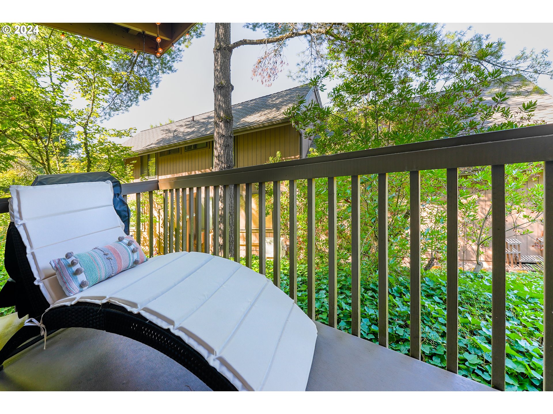 7702 Southwest Barnes Road, Unit D Portland, OR 97225 - Photo 14 of 24 a view of a balcony with wooden floor