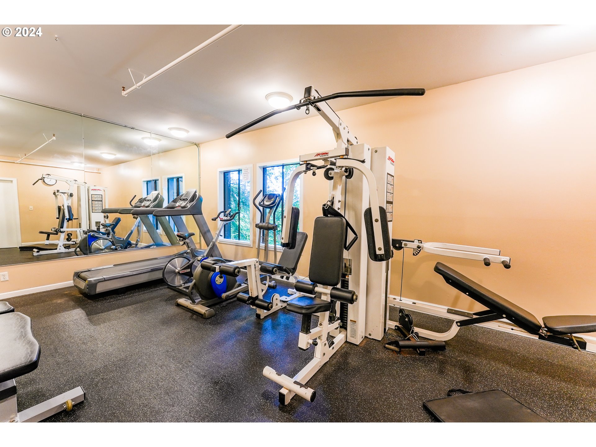 7702 Southwest Barnes Road, Unit D Portland, OR 97225 - Photo 22 of 24 a view of a room with gym equipment