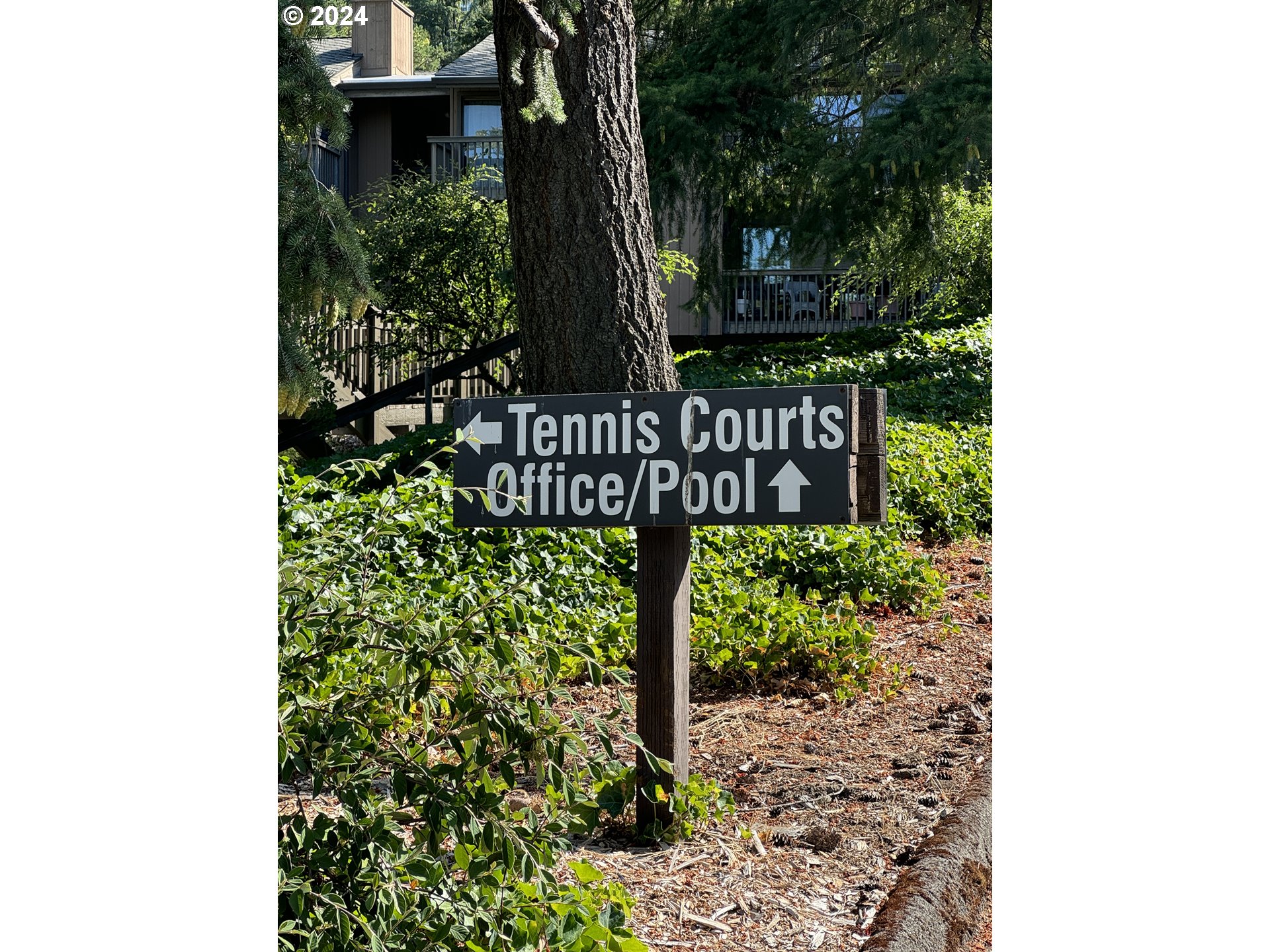 7702 Southwest Barnes Road, Unit D Portland, OR 97225 - Photo 23 of 24 a view of outdoor space with sign broad