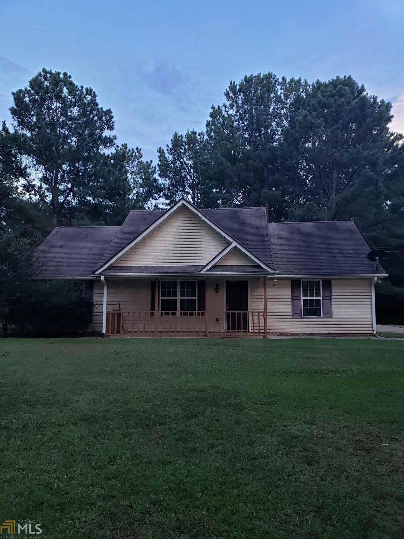 4051 Jeff Davis Road Thomaston, GA 30286 - Photo 1 of 1 a front view of a house with a garden