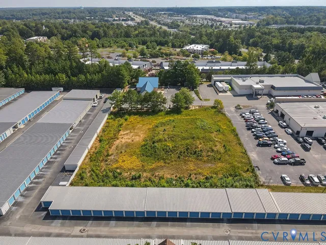 an aerial view of a residential houses with city view