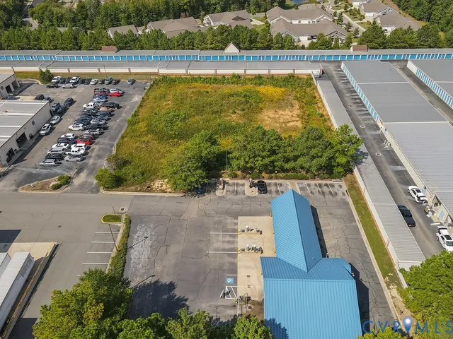 an aerial view of a house with a swimming pool
