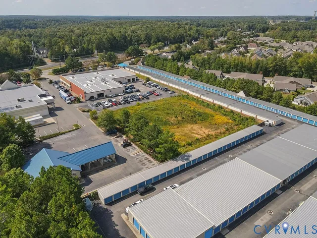 an aerial view of residential houses and outdoor space
