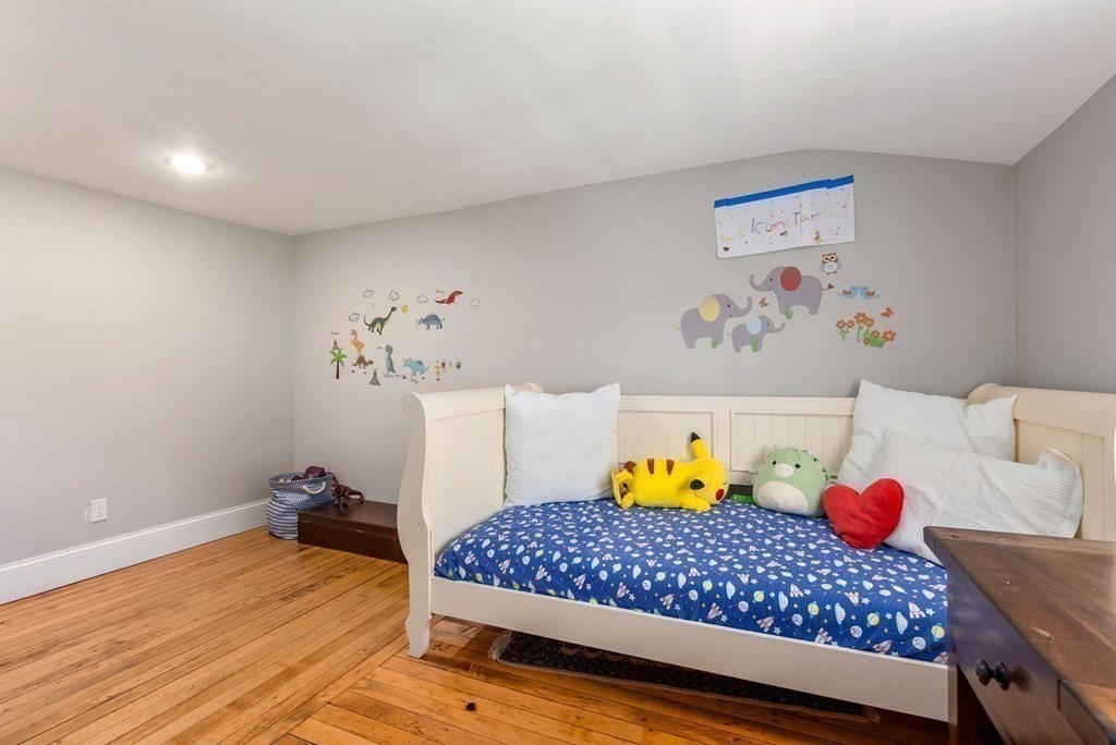 4 Granison Road Weston, MA 02493 - Photo 29 of 37 a bedroom with a bed and wooden floor