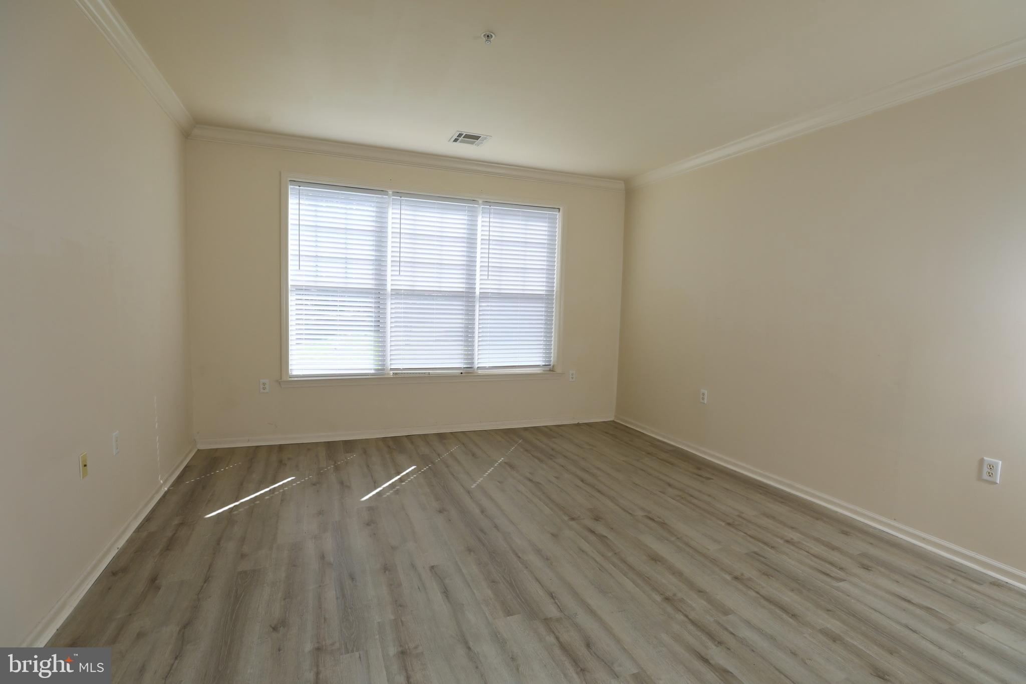 611 Masterson Court Ewing, NJ 08618 - Photo 14 of 38 an empty room with wooden floor and windows