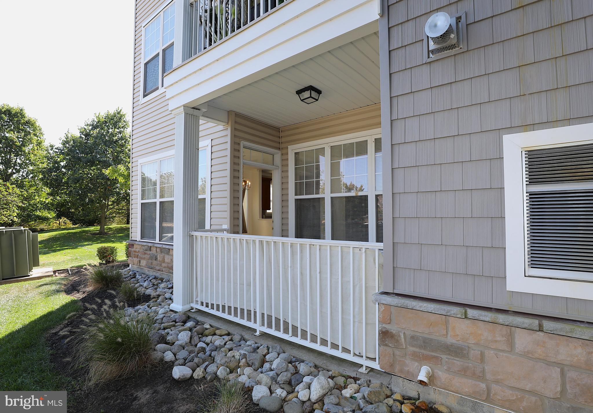 611 Masterson Court Ewing, NJ 08618 - Photo 33 of 38 a view of a house with a small yard and wooden floor and fence