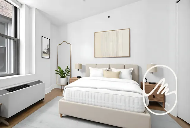 a bedroom with a bed and a potted plant