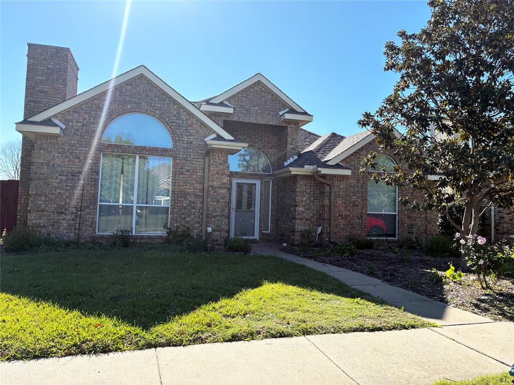7936 Tournament Road Frisco, TX 75035 - Photo 4 of 28 a front view of a house with a yard