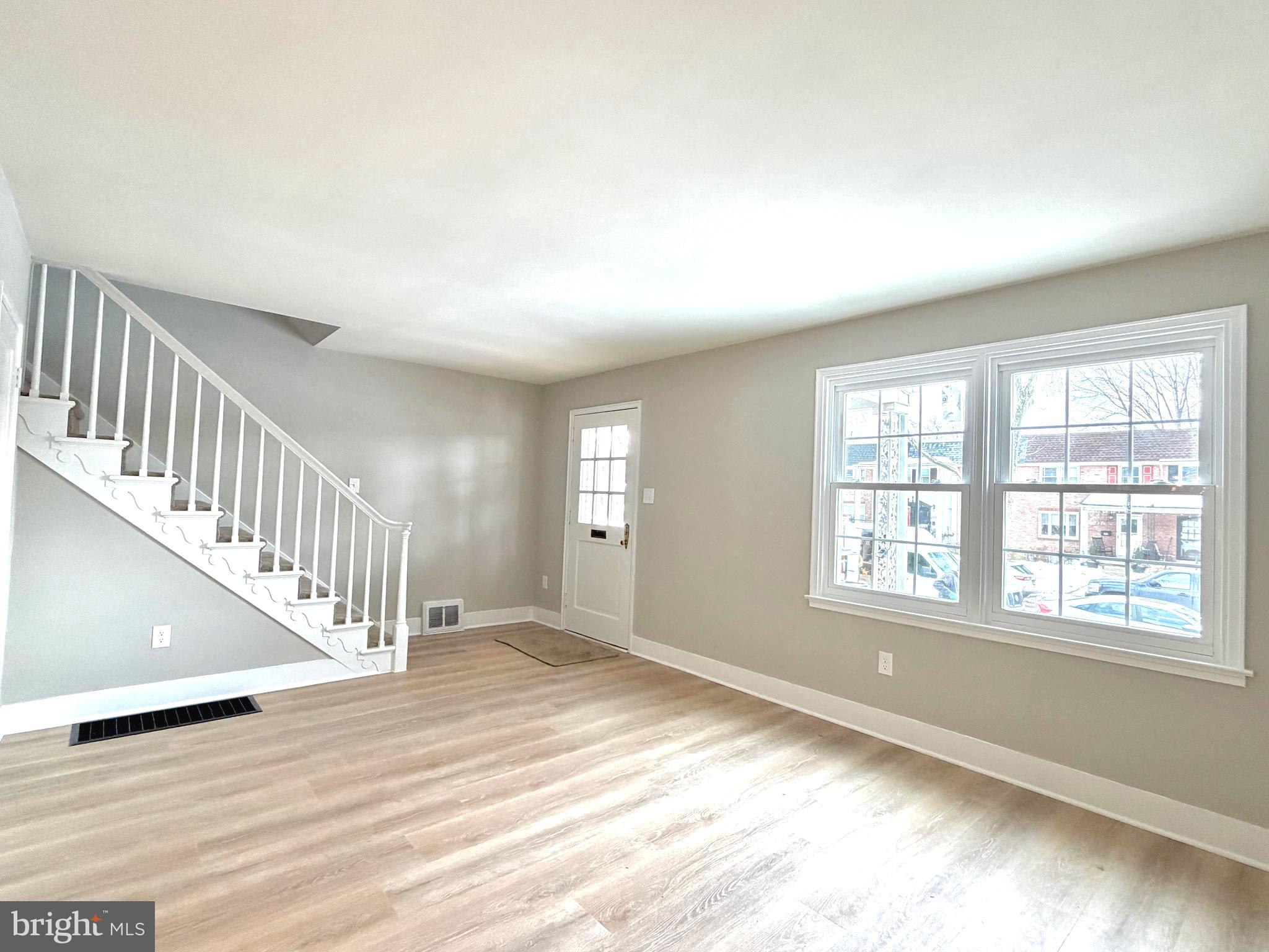 244 Sycamore Road Reading, PA 19611 - Photo 3 of 27 a view of an empty room with wooden floor and a window