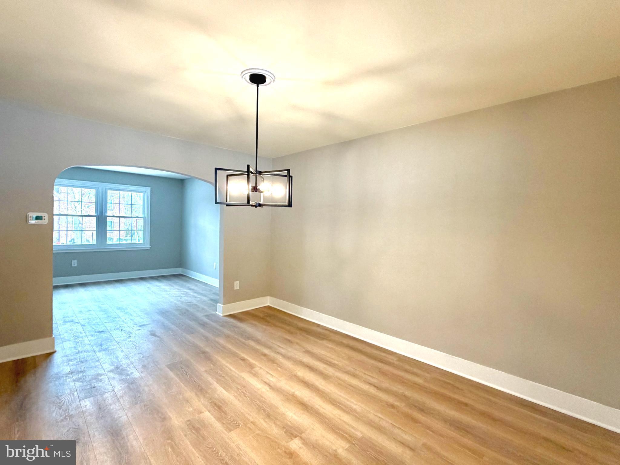 244 Sycamore Road Reading, PA 19611 - Photo 5 of 27 a view of empty room with wooden floor and fan