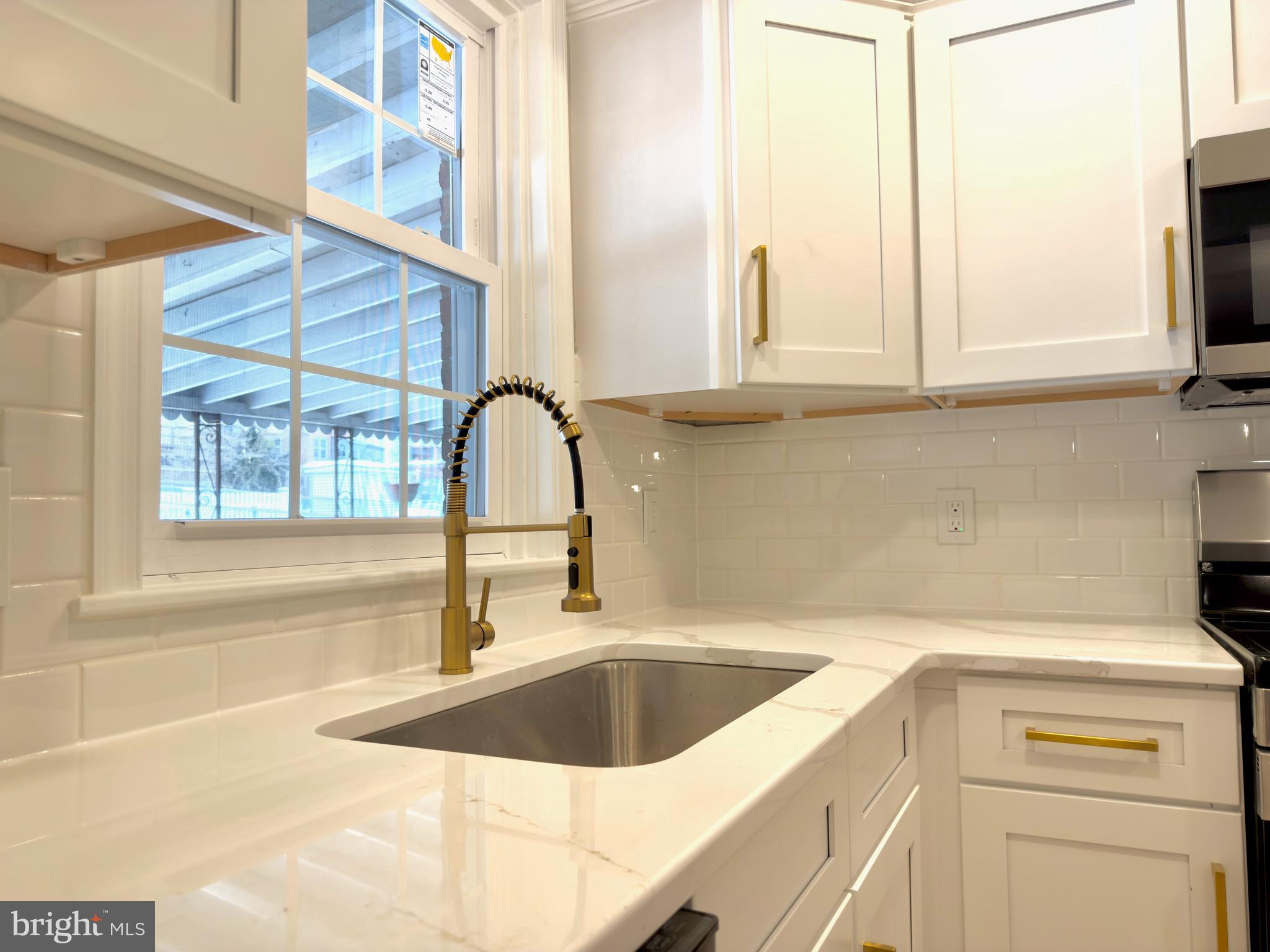 244 Sycamore Road Reading, PA 19611 - Photo 10 of 27 a kitchen with a sink and a window