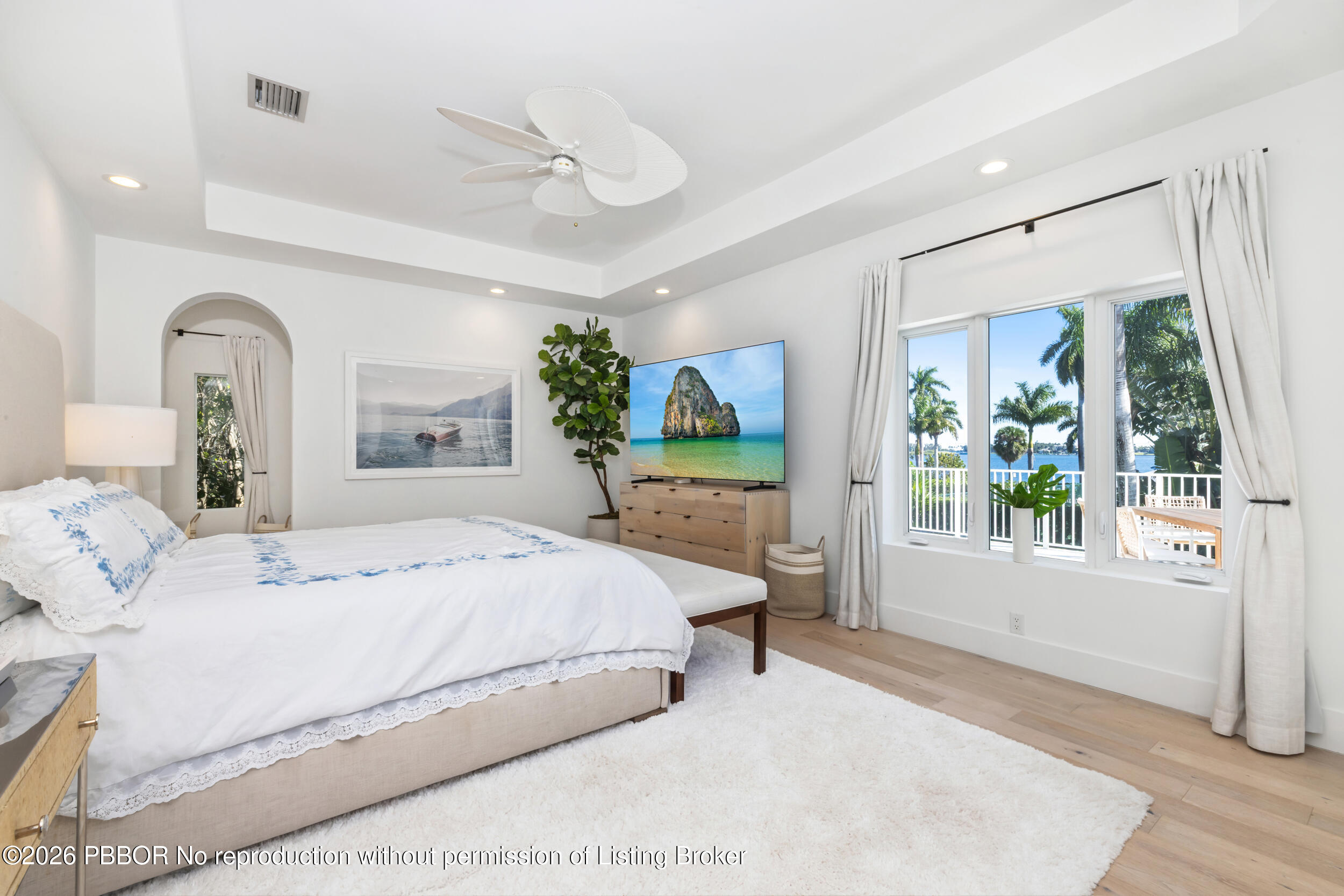 121 Seville Road West Palm Beach, FL 33405 - Photo 34 of 67 a bedroom with a large bed and windows