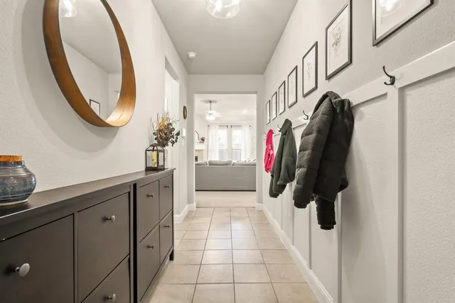 a walk in closet with view of bathroom