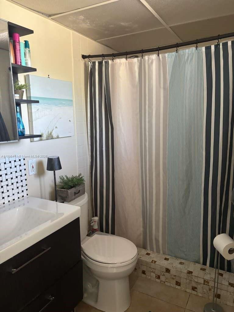 8400 Southwest 133rd Avenue Road, Unit 202 Miami, FL 33183 - Photo 16 of 23 a bathroom with a sink toilet and shower