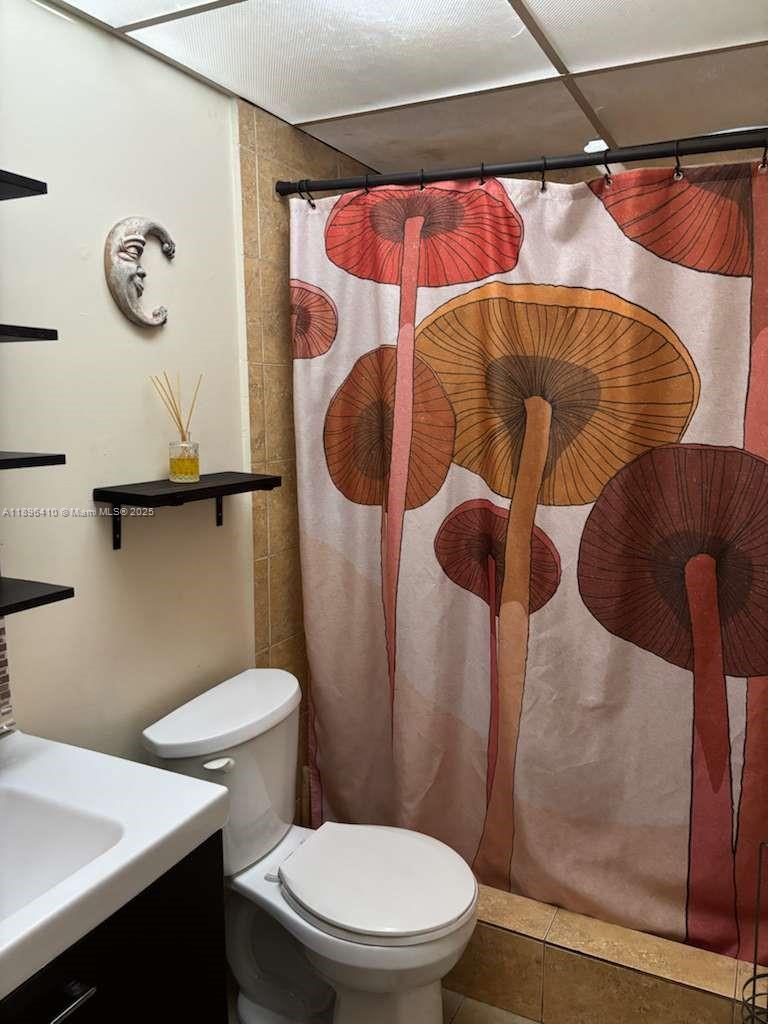 8400 Southwest 133rd Avenue Road, Unit 202 Miami, FL 33183 - Photo 17 of 23 a bathroom with a toilet and a shower