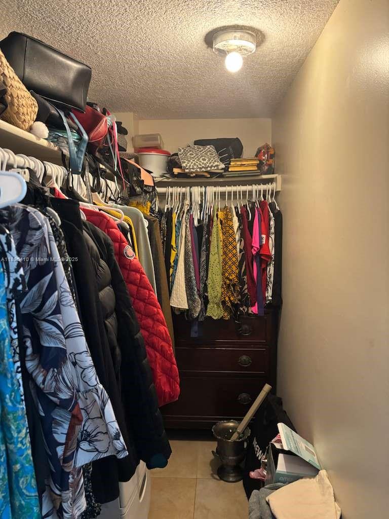 8400 Southwest 133rd Avenue Road, Unit 202 Miami, FL 33183 - Photo 19 of 23 a view of walk in closet with clothes