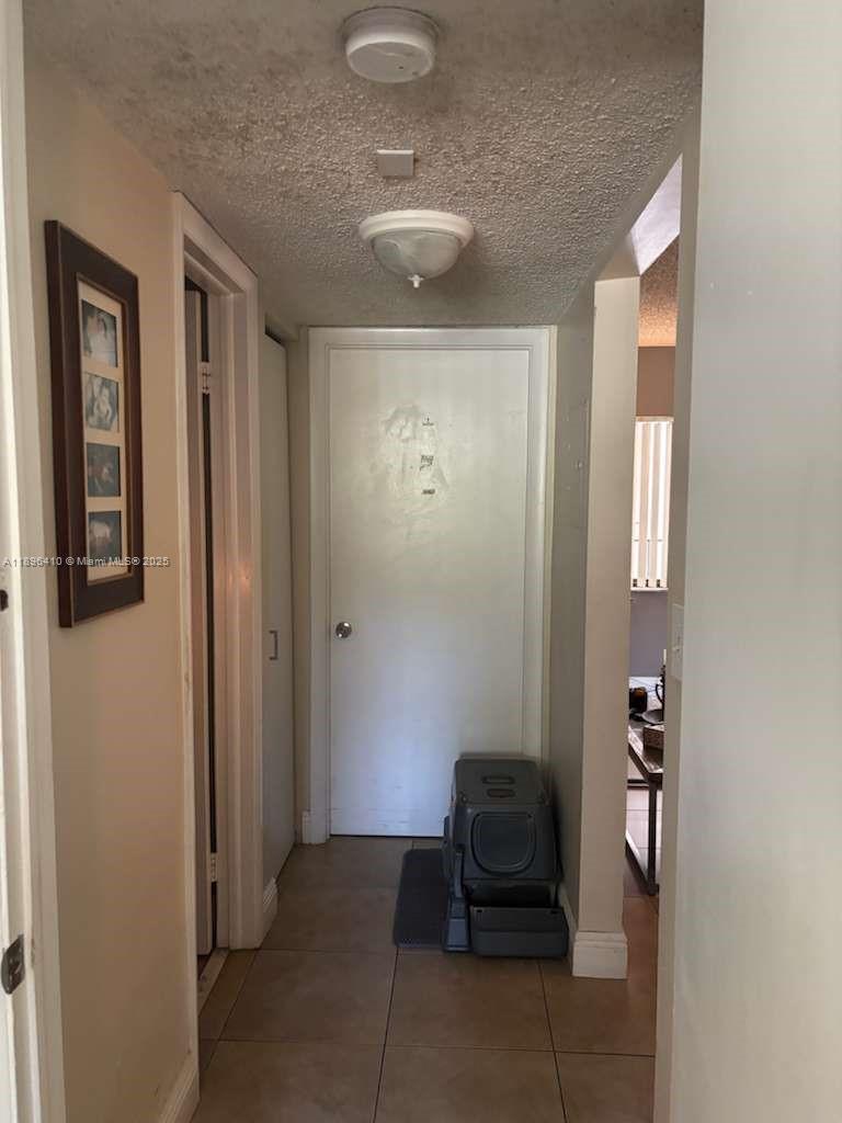8400 Southwest 133rd Avenue Road, Unit 202 Miami, FL 33183 - Photo 21 of 23 a very nice looking room with a mirror