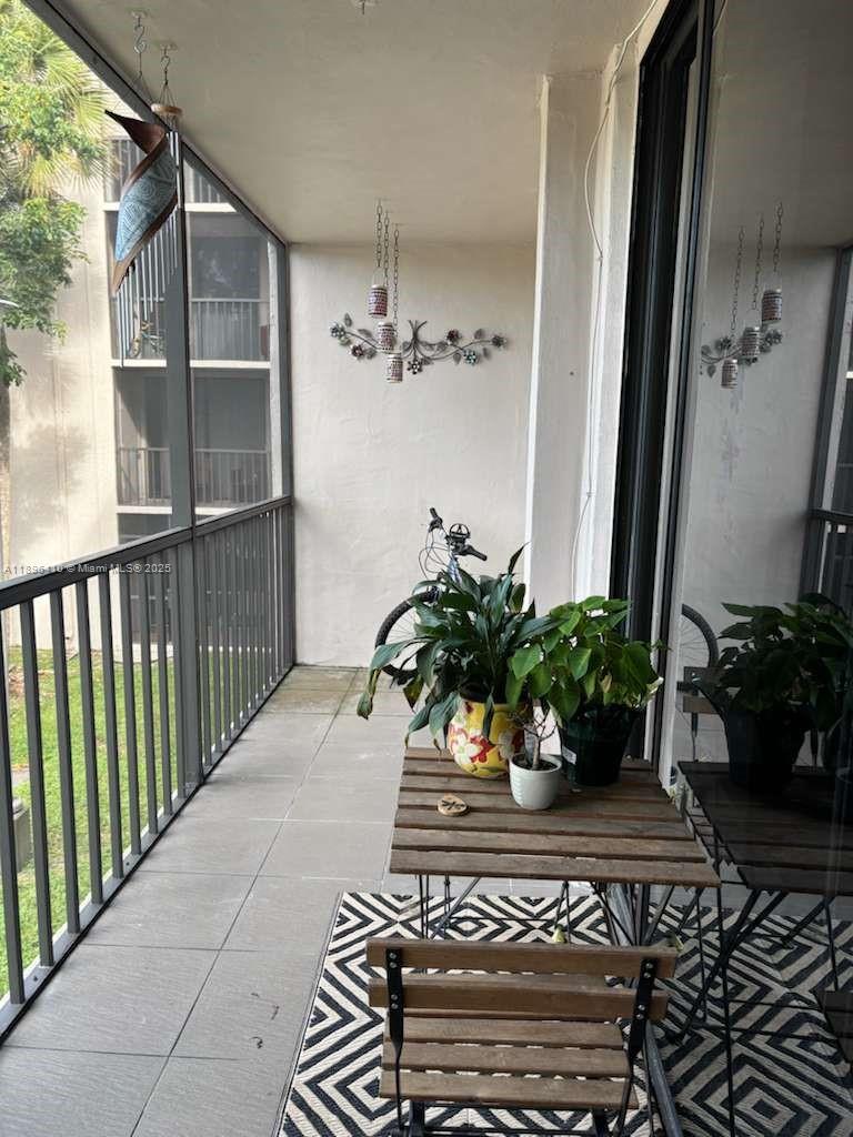 8400 Southwest 133rd Avenue Road, Unit 202 Miami, FL 33183 - Photo 23 of 23 a potted plant sitting in front of a house