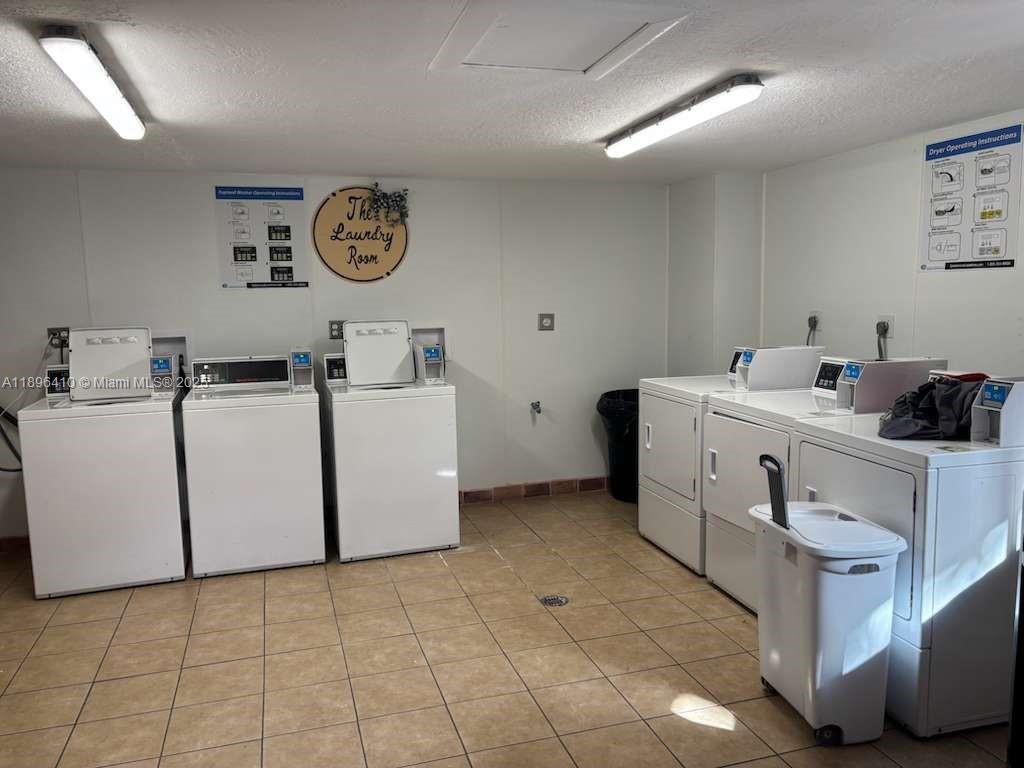 8400 Southwest 133rd Avenue Road, Unit 202 Miami, FL 33183 - Photo 9 of 23 a utility room with dryer and washer