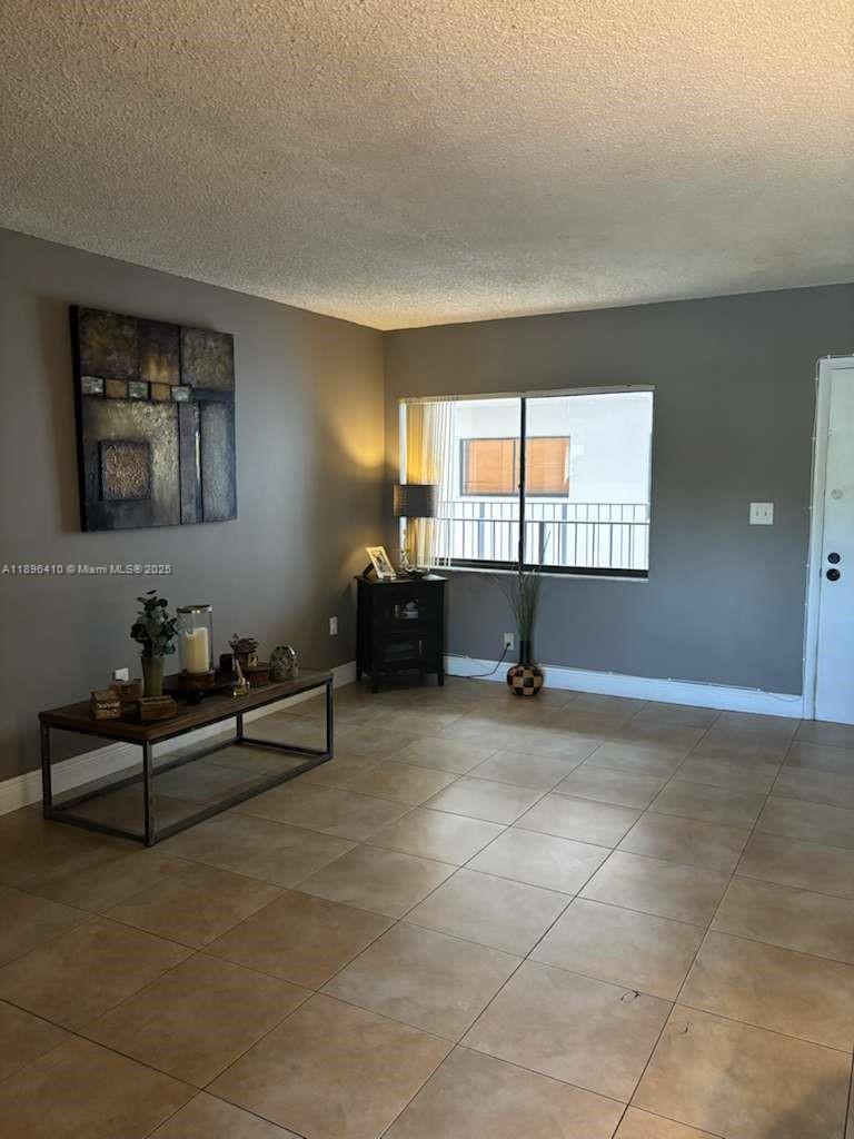 8400 Southwest 133rd Avenue Road, Unit 202 Miami, FL 33183 - Photo 10 of 23 a living room with furniture and window