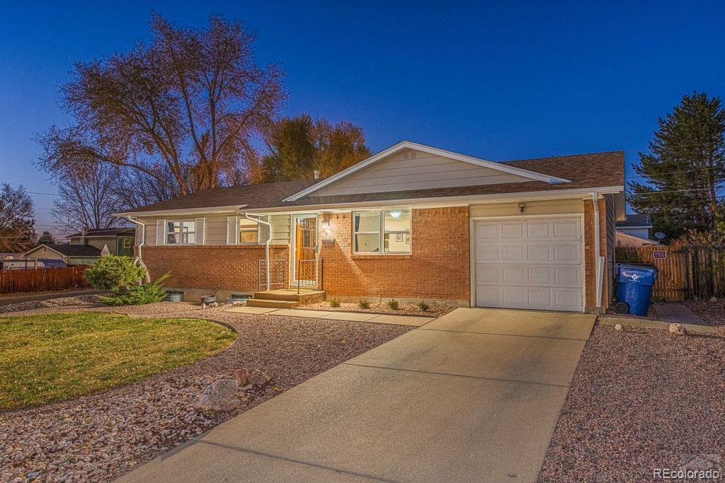49 Calhoun Road Pueblo, CO 81001 - Photo 1 of 24 a front view of a house with a yard