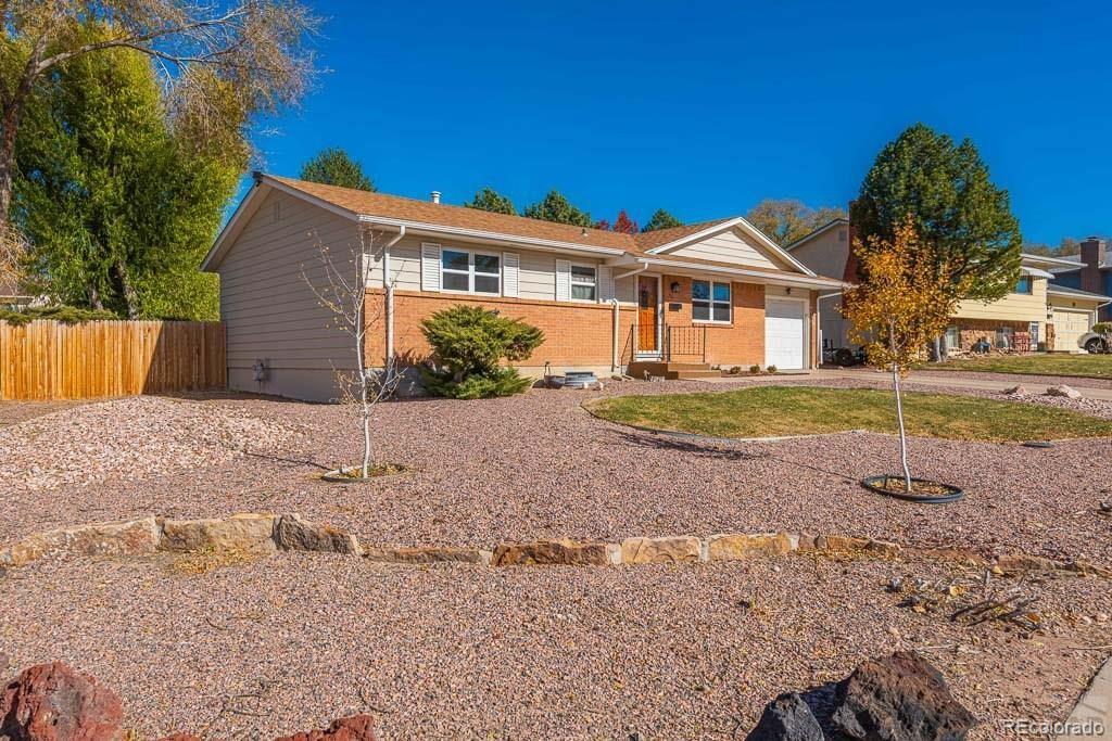 49 Calhoun Road Pueblo, CO 81001 - Photo 4 of 24 a front view of a house with a yard
