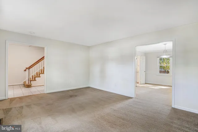 an empty room with windows and outdoor view