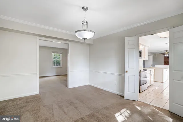 a kitchen with stainless steel appliances a stove microwave and sink