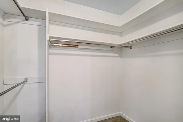 a view of an empty room with an entryway