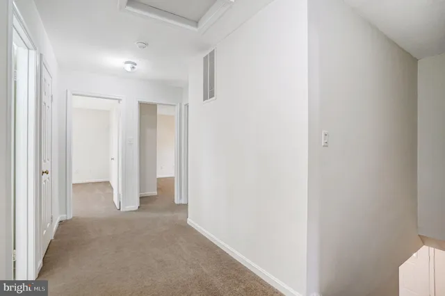 a view of a house with a large tree