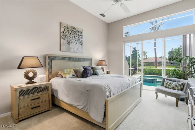 a bedroom with a bed dresser and a window