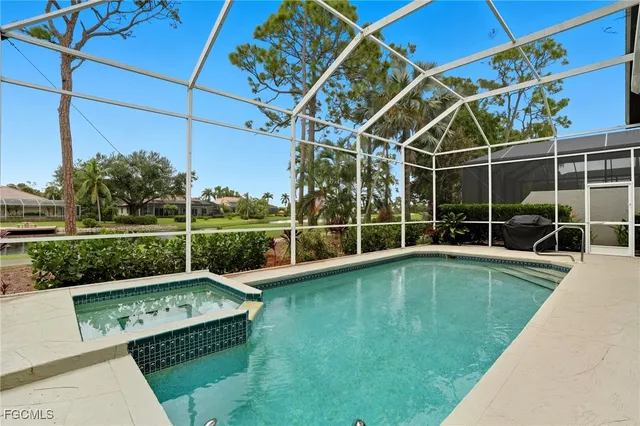 a view of a backyard with a swimming pool