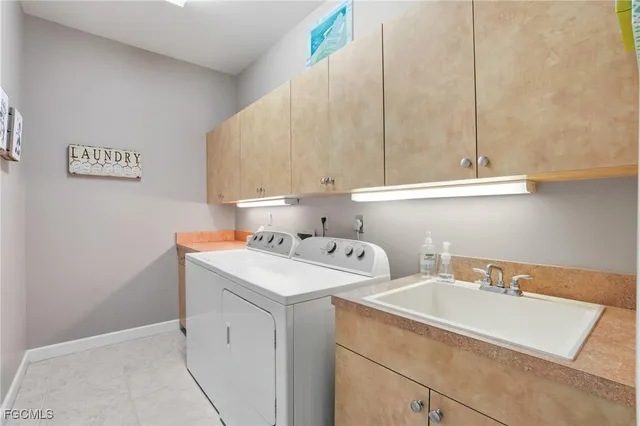 an aerial view of a house with a garden and lake view