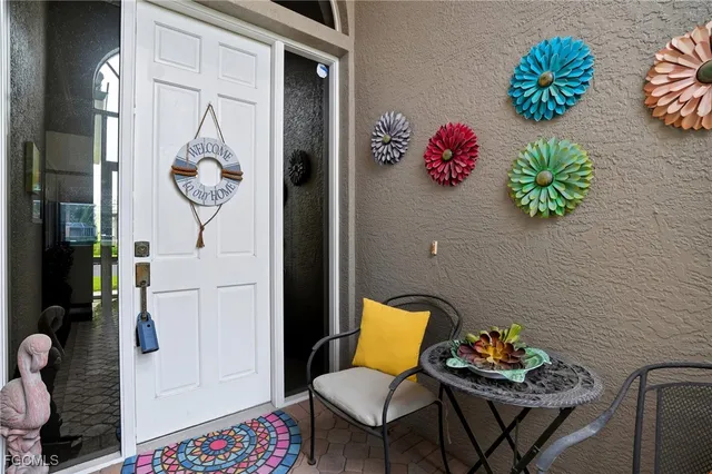 a very nice looking room with many windows and furniture