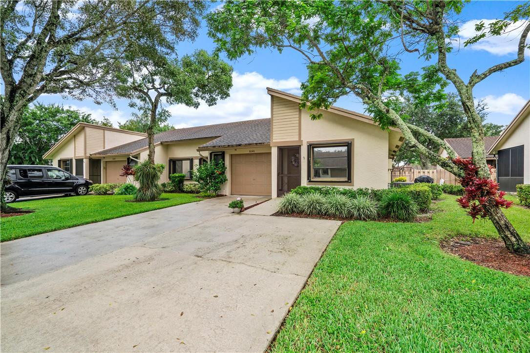 8046 Summerview Terrace Boca Raton, FL 33496 - Photo 1 of 25 a front view of house with yard and green space