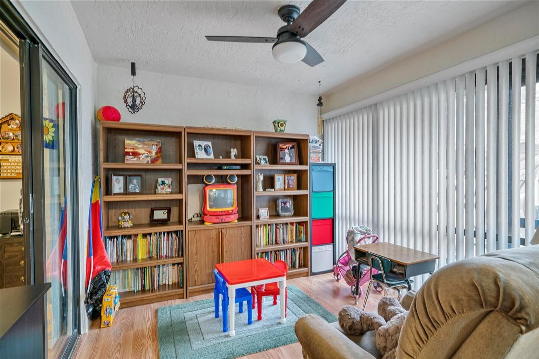 8046 Summerview Terrace Boca Raton, FL 33496 - Photo 11 of 25 a living room with furniture cabinets and book shelf