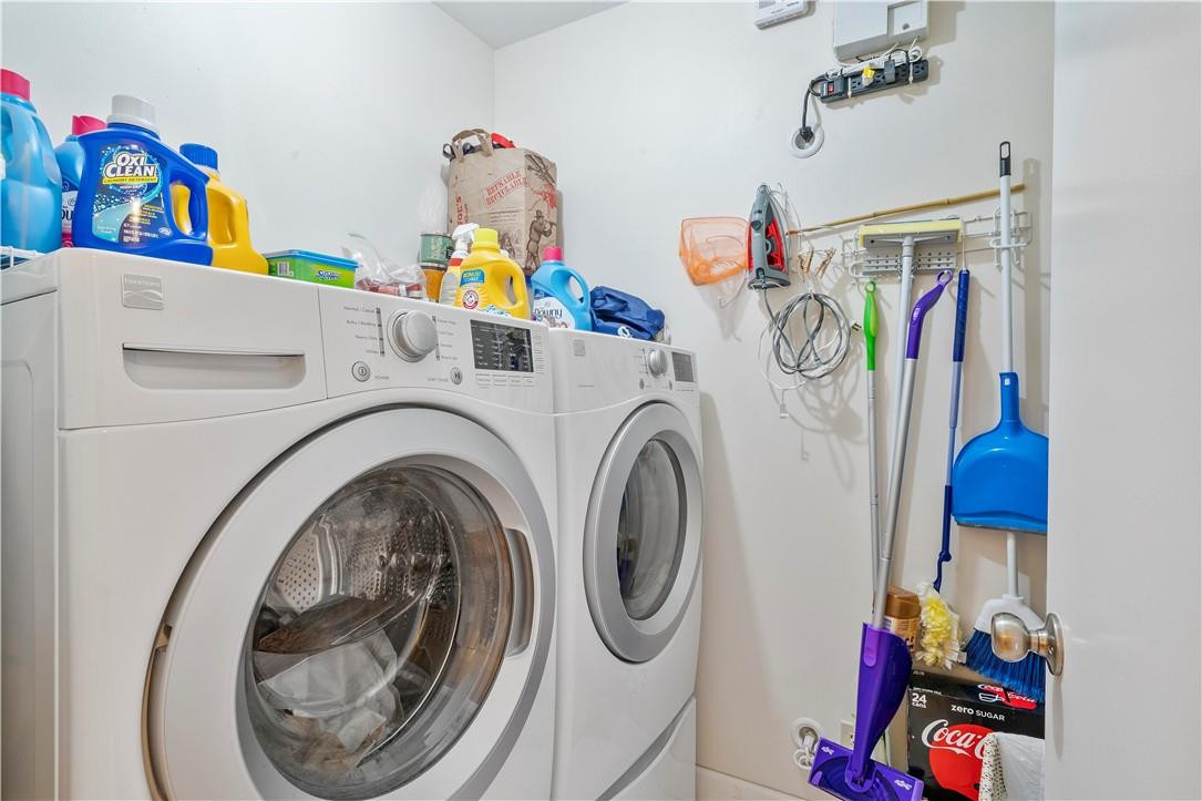 8046 Summerview Terrace Boca Raton, FL 33496 - Photo 13 of 25 a utility room with multiple dryer and washer