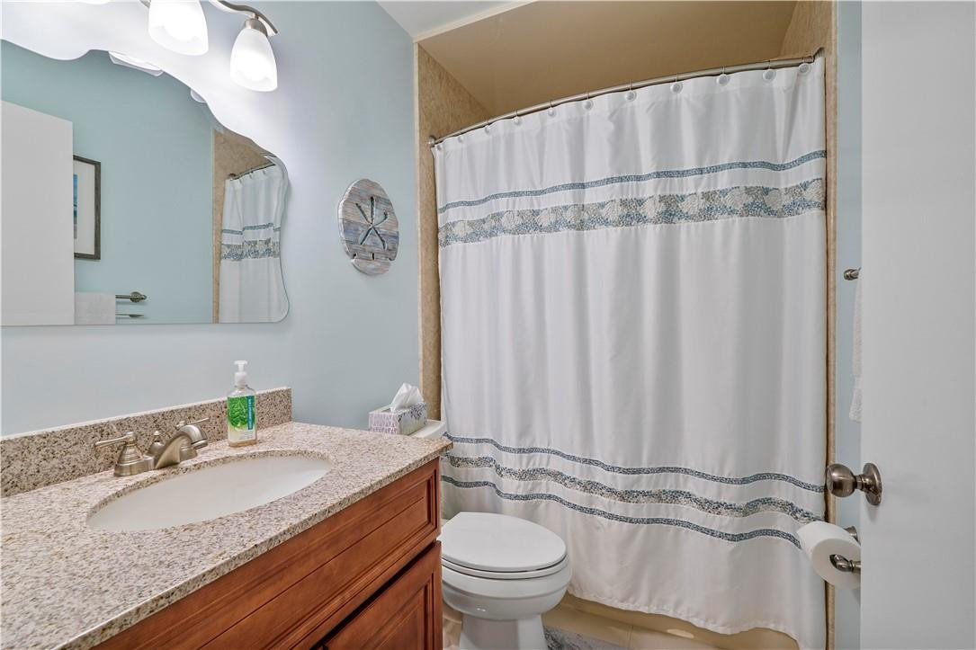 8046 Summerview Terrace Boca Raton, FL 33496 - Photo 15 of 25 a bathroom with a granite countertop sink and a mirror