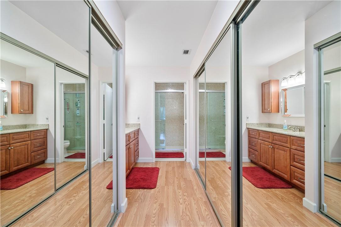 8046 Summerview Terrace Boca Raton, FL 33496 - Photo 18 of 25 a bathroom with a tub shower and mirror