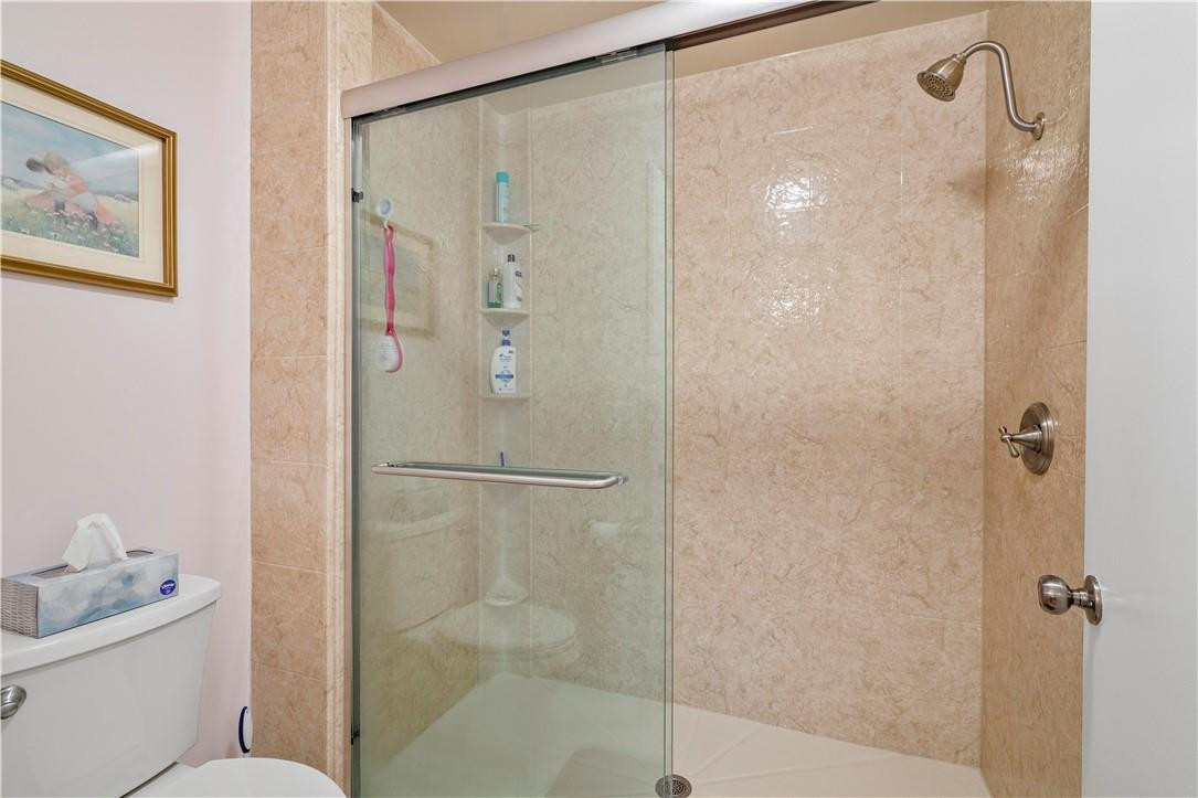 8046 Summerview Terrace Boca Raton, FL 33496 - Photo 20 of 25 a bathroom with a shower toilet and sink