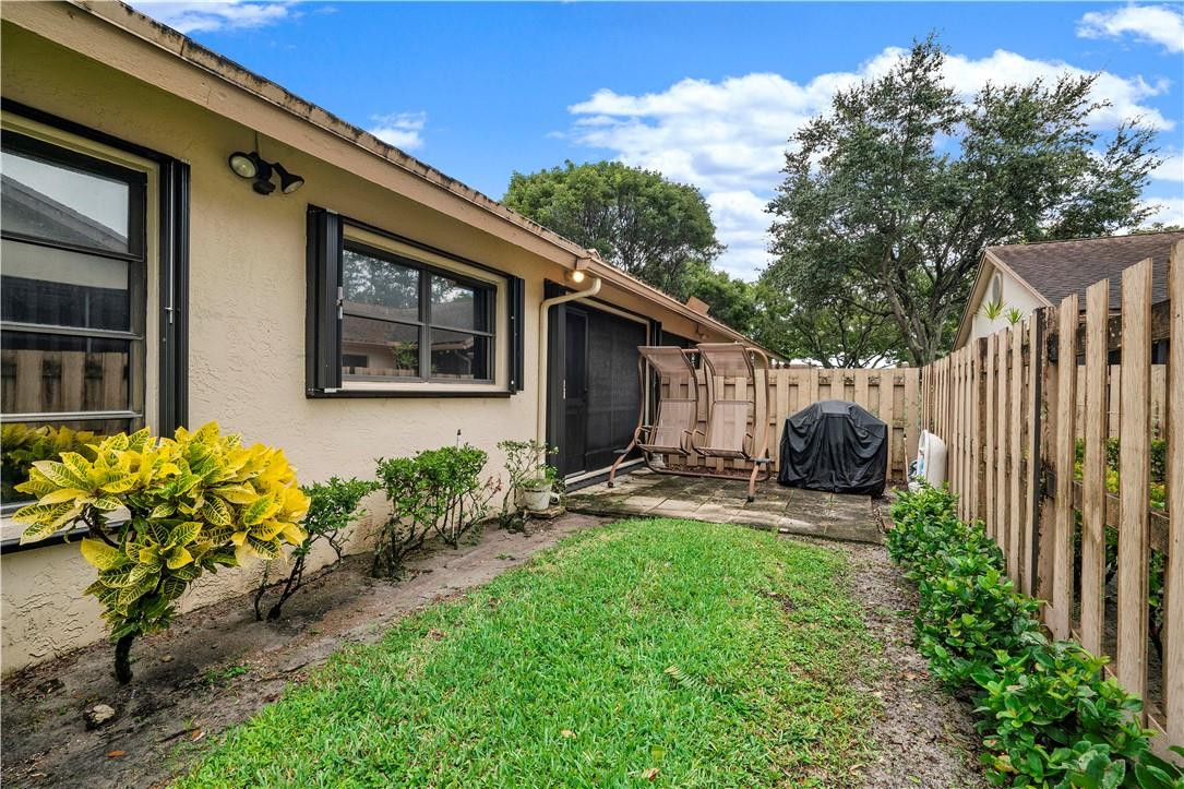 8046 Summerview Terrace Boca Raton, FL 33496 - Photo 22 of 25 a house view with a garden space
