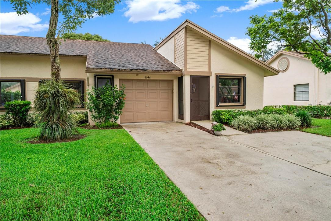 8046 Summerview Terrace Boca Raton, FL 33496 - Photo 3 of 25 a front view of a house with a yard