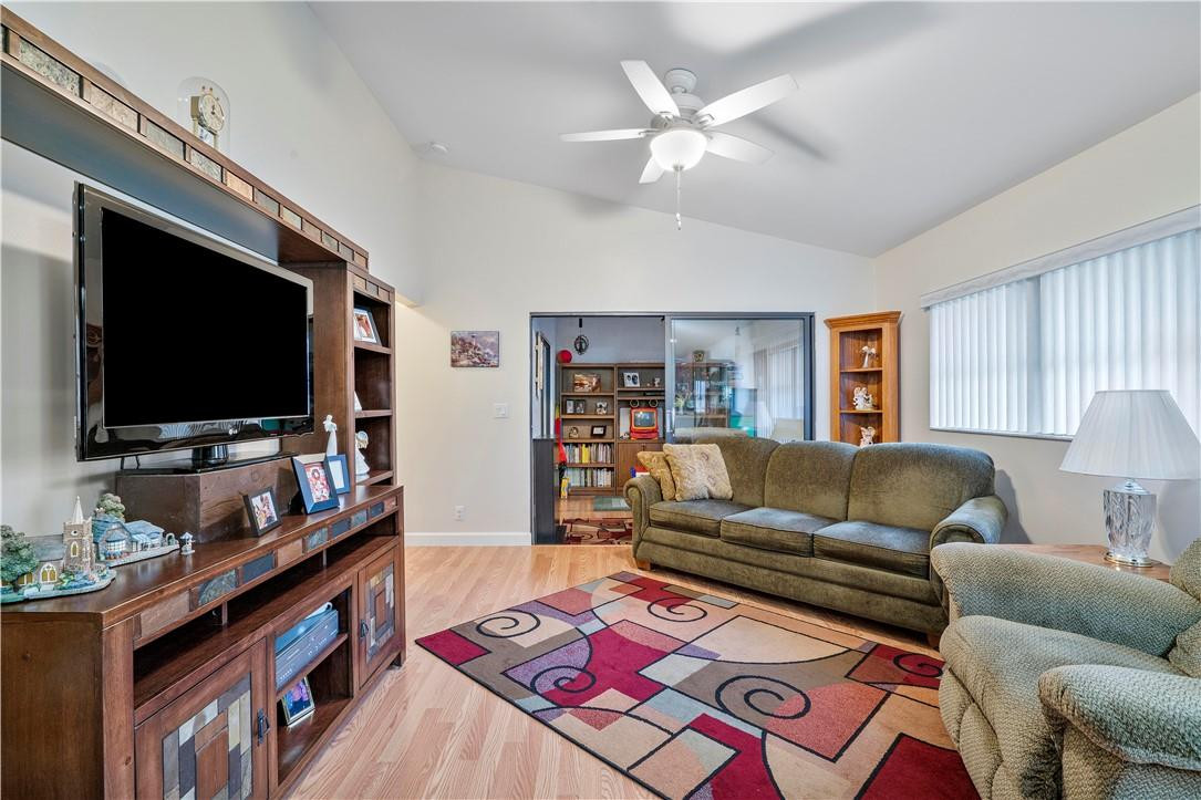 8046 Summerview Terrace Boca Raton, FL 33496 - Photo 8 of 25 a living room with furniture and a flat screen tv