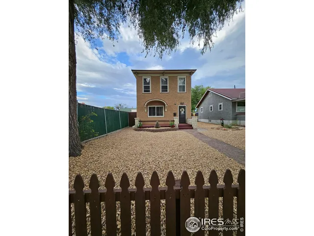 a front view of a house with backyard